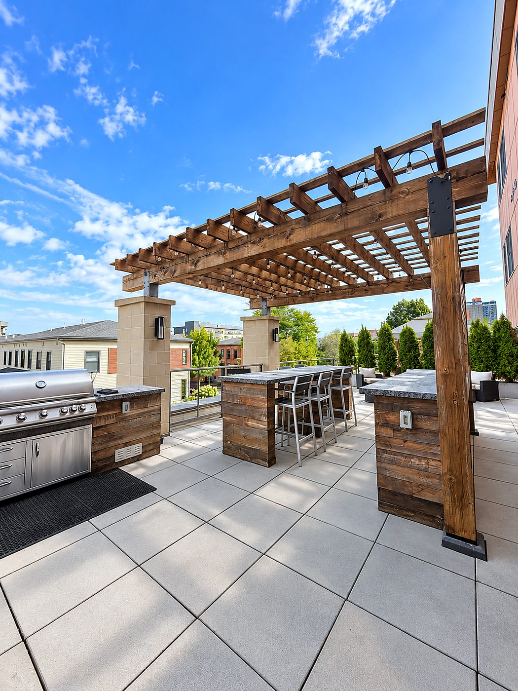 The terrace at 50 Charlotte Square, with the pergola, the shared grills and bar seating